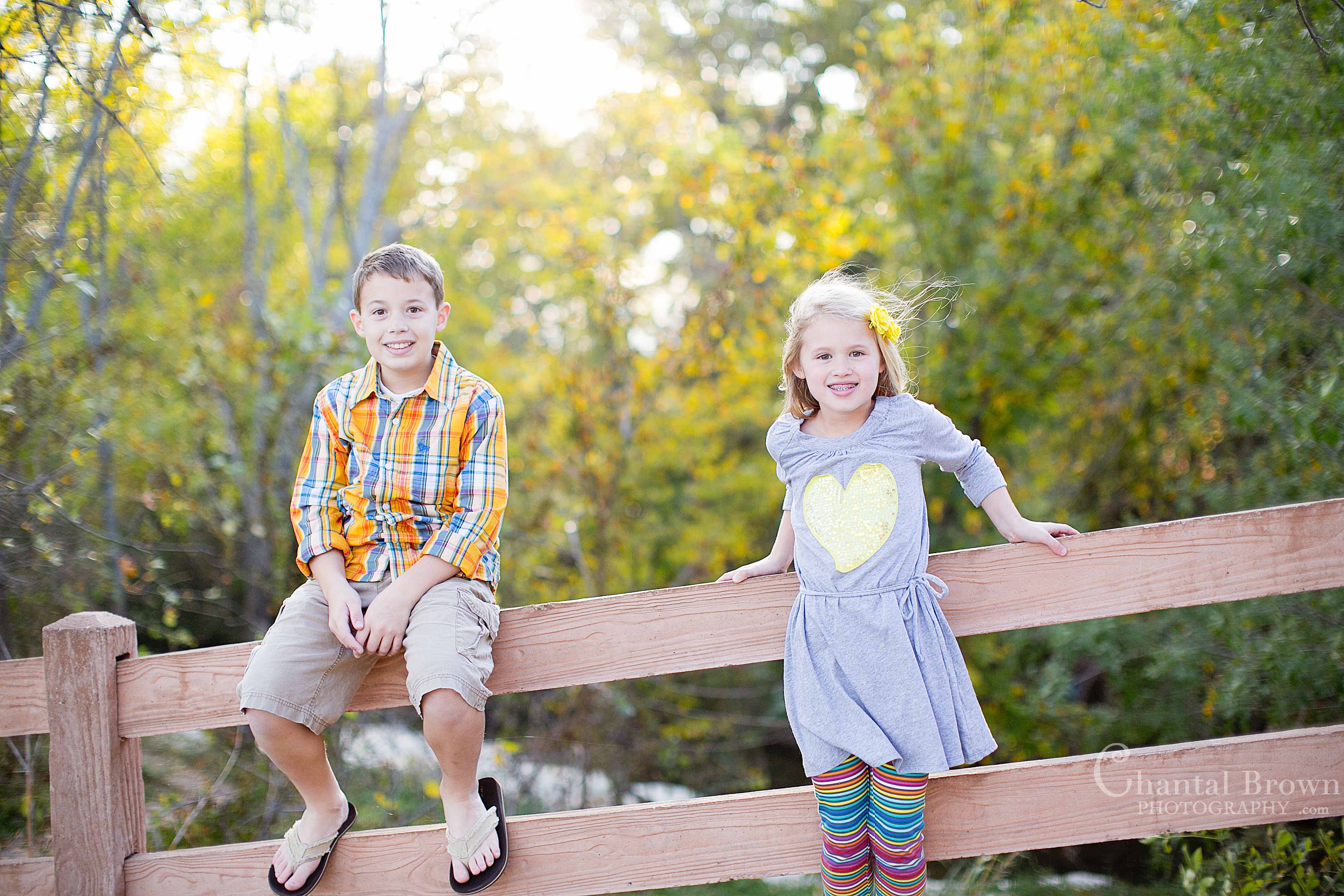 Richardson-Breckinridge-Park-13 Breckinridge Park in Richardson Texas children smiling setting on old barn brown fence sunset beautiful autumn fall leave colors